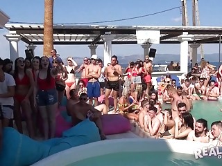 Babes get wild in a pool at an outdoor party